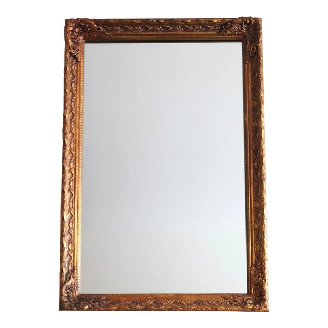 1970s Carved Floral Wood Mirror Finished in Gold Gilt For Sale