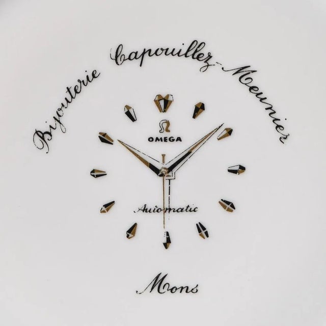 Porcelain plate decorated with Omega wristwatches advert. Made in France in 1960s. This piece has an attribution mark, I...