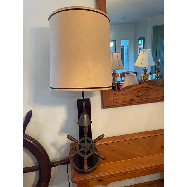 Vintage Ship Table Lamp with wheel & bell and ship design on shade Measures about 40” high