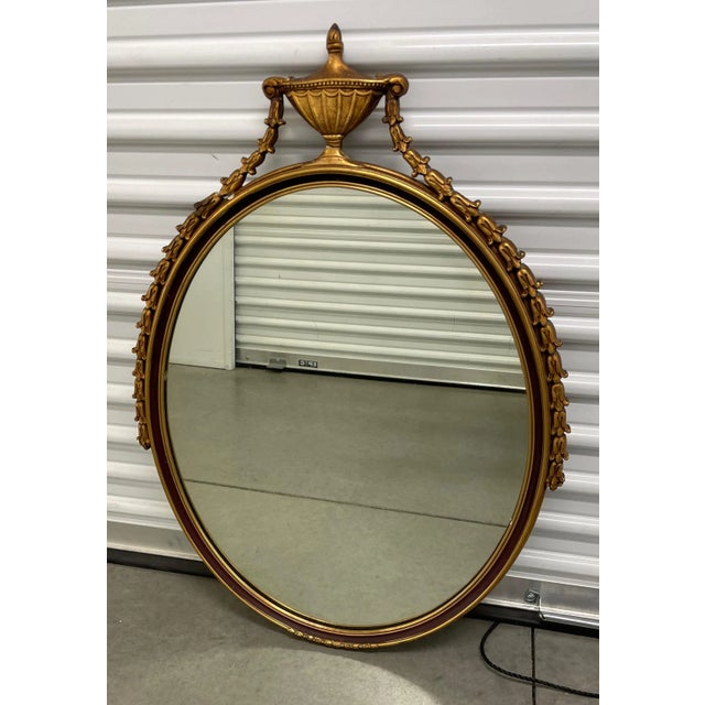 Discover the timeless elegance of this stunning antique French Neoclassical mirror. This exquisite piece features a...
