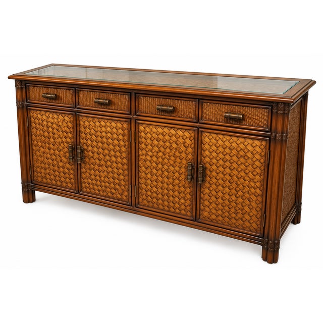 Bring a touch of tropical elegance to your home with this vintage rattan and bamboo-style sideboard. Featuring a rich warm...