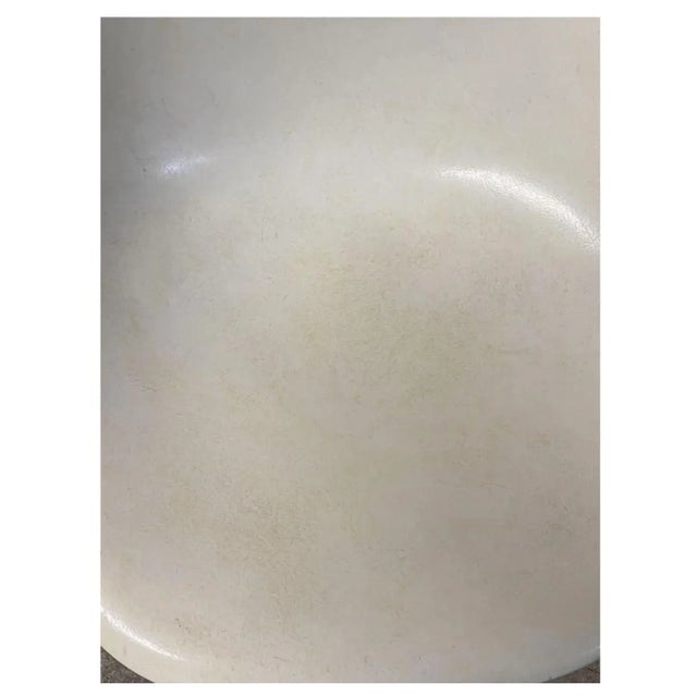 Set of 4 vintage white fiberglass Eames chairs by Herman Miller. All original, not a recent edition. Stamped under.