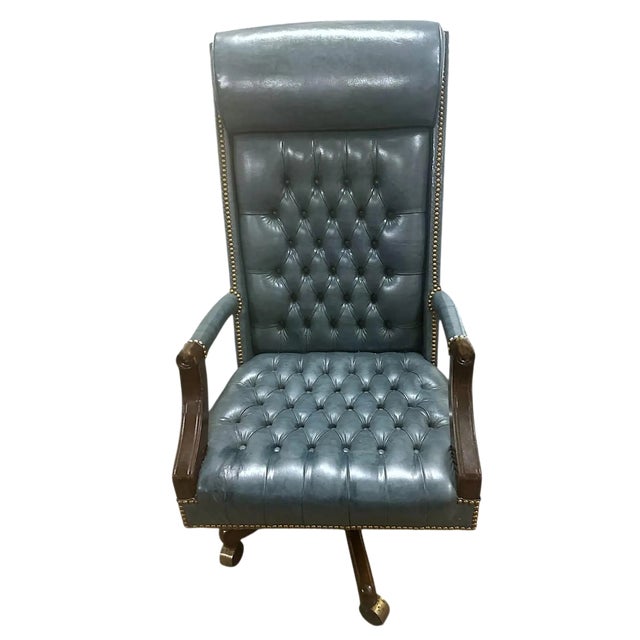 Vintage Circa 2005-2010 Tall Blue Tufted Executive Swivel Chair Made in Indiana by Jasper Seating Company. It is a family-...