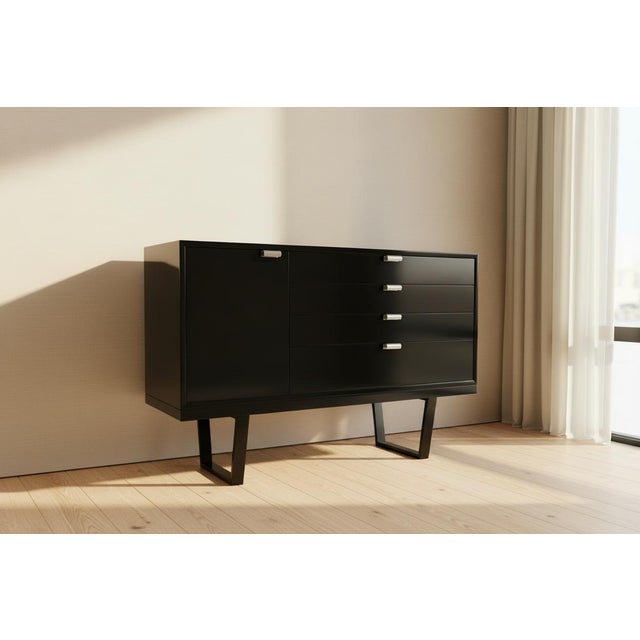 An authentic mid-century cabinet designed by George Nelson for Herman Miller￼, circa 1950s. This piece features a clean...