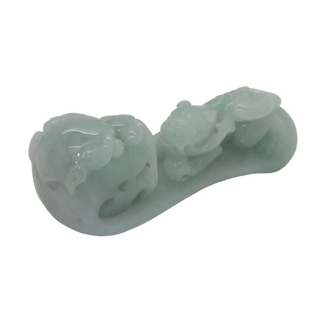 This beautiful tabletop figure is carved from natural untreated jade, the motif of this display is a carved dragon and...