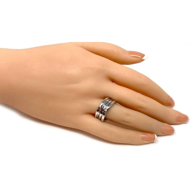 This authentic Bvlgari B.zero1 three-row ring is crafted in solid 18k white gold and features the collections iconic...
