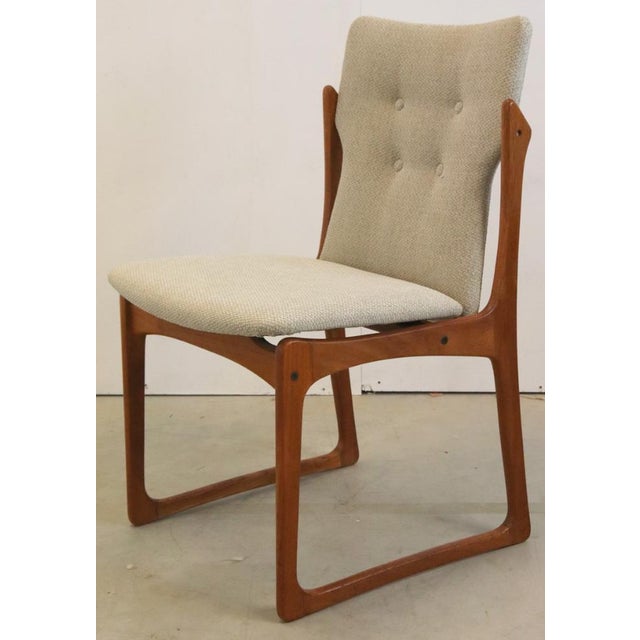 This set of four Danish dining room chairs radiates the timeless elegance of the Mid Century Modern Design. Made from warm...