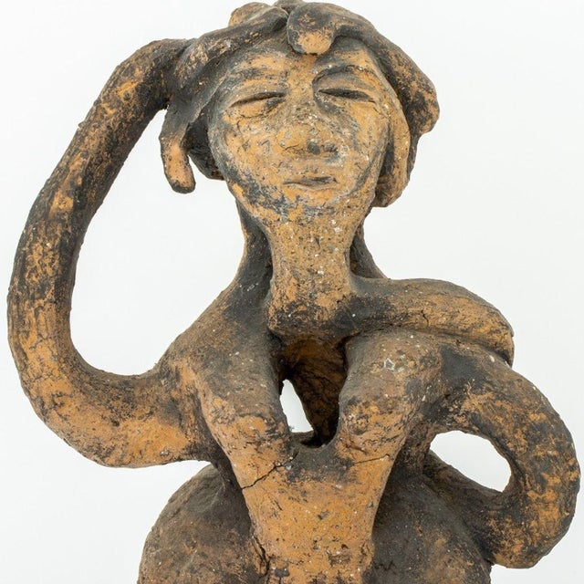 Folk Art Abstract Female Figure Terracotta Statue, the standing figure with interlacing forms. 16" H x 10.5" W x 7 " D....