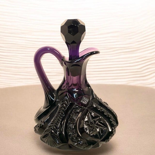 This mid century pressed glass cruet features the classic Moon and Star pattern, a historic American glass design first...