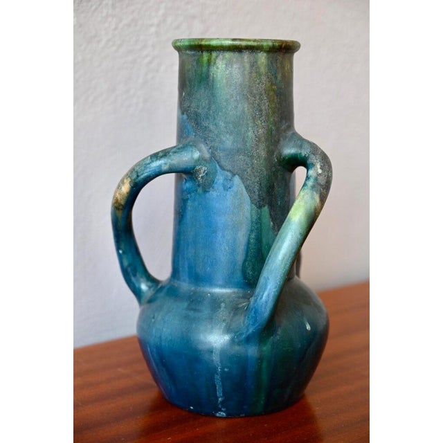 This large vase is an Art Nouveau piece by Charles Maes, produced in Sint-Amandsberg, Belgium, around 1905-1909....