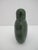 Antique Chinese snuff bottle carved from single spinach green jade stone with matching stopper. Measures 3" tall x 2 3/8"...