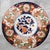 This impressive 19th-century Japanese Imari porcelain charger (Meiji period) measures a substantial 14.2 inches in...