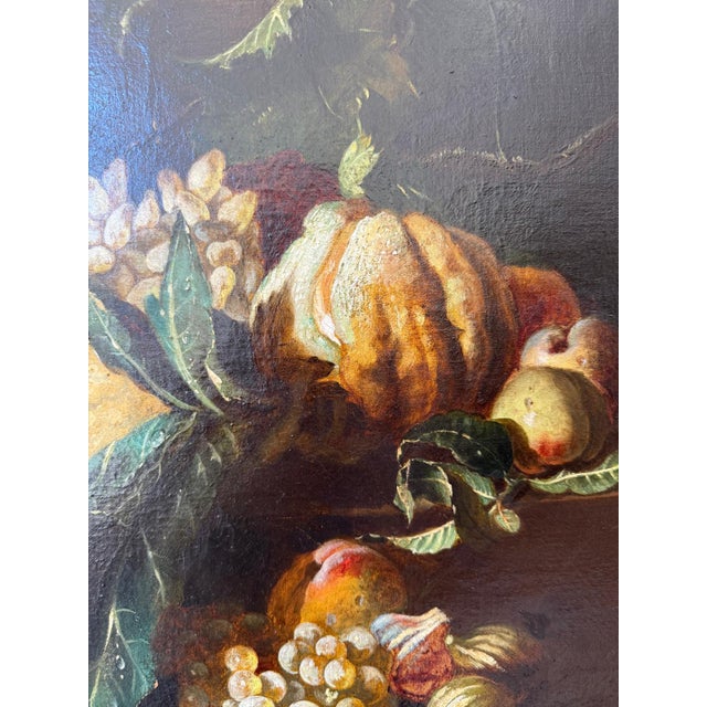 A magnificent signed Baroque still life bursting with luscious fruit — ripe peaches, clusters of grapes, juicy figs,...