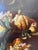 A magnificent signed Baroque still life bursting with luscious fruit — ripe peaches, clusters of grapes, juicy figs,...