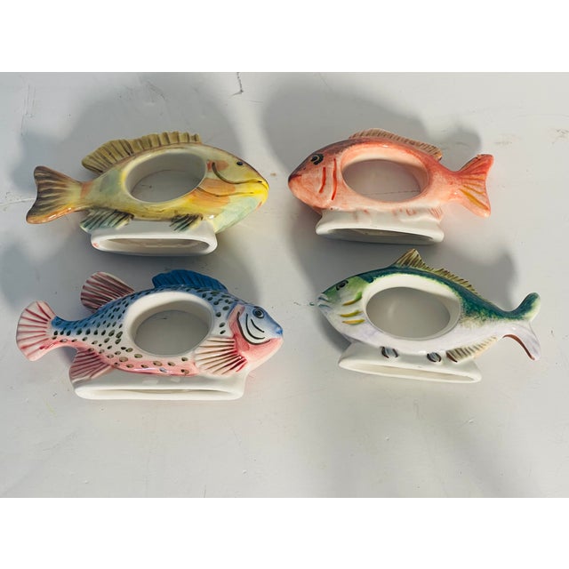 Colorful ceramic Williams Sonoma napkin rings in fish shape.