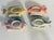 Colorful ceramic Williams Sonoma napkin rings in fish shape.
