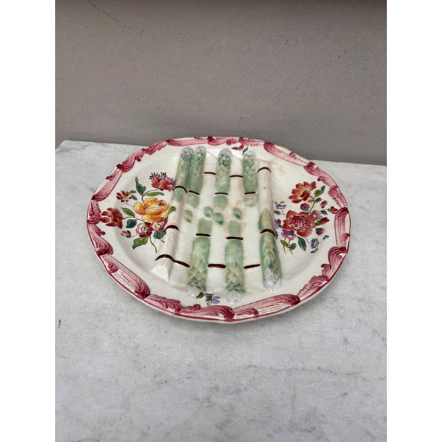 Majolica asparagus plate with flowers , signed Longchamp circa 1890.