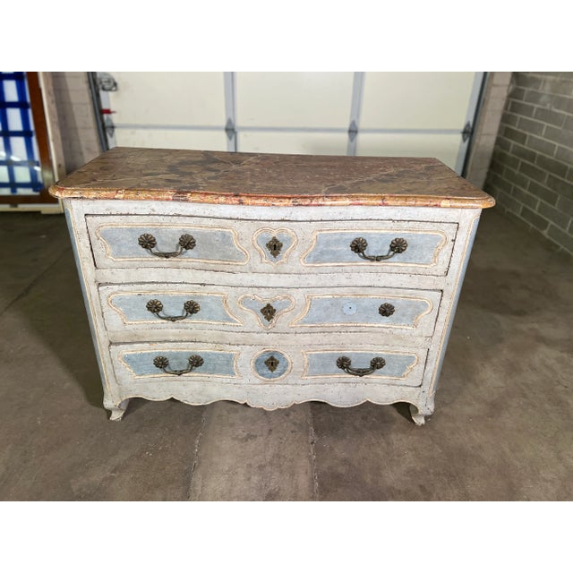 This is a beautiful piece of French painted furniture with the original paint and hardware. The faux marble top is...