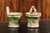 A pair of rustic French pottery hanging planters from the 19th century, with green and yellow glaze. Created in France...