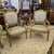 Elegant French-inspired armchair set upholstered in a refined beige damask fabric with a delicate floral motif. The...