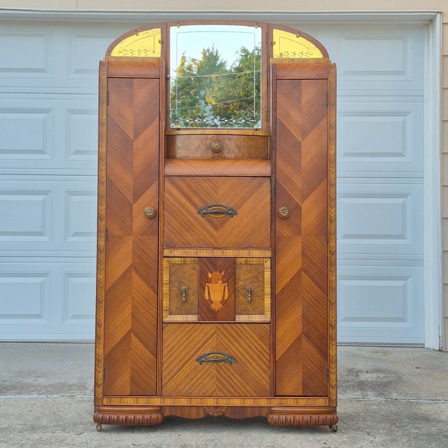 This is a gorgeous art deco era waterfall armoire that could be used as a hall foyer coat closet or for bedroom clothes...