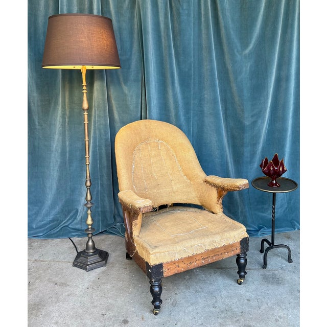 French 1940s Brass and Bronze Floor Lamp This elegant French floor lamp from the 1940s embodies timeless sophistication....