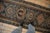 :: Single column center medallions in alternating and partially asymmetric weight atop a covered field of floral top views...