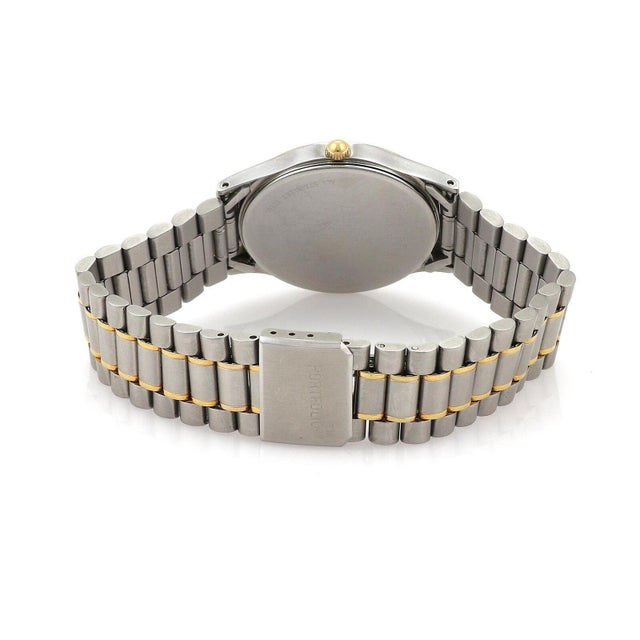 This is a designer vintage Tiffany & Co. stainless steel and gold tone Portfolio men's wrist watch. The case is...