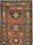 This early 20th-century Persian Heriz long runner presents a bold geometric composition across a warm rust-red field. A...