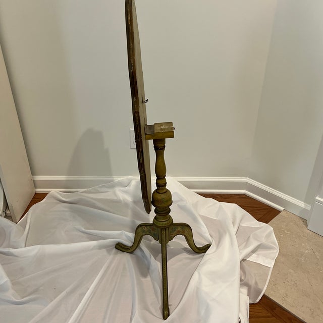 Tilt table. Antique hand painted and decoupage. Table stands as a fire screen or top can be fastened flat. Table height is...