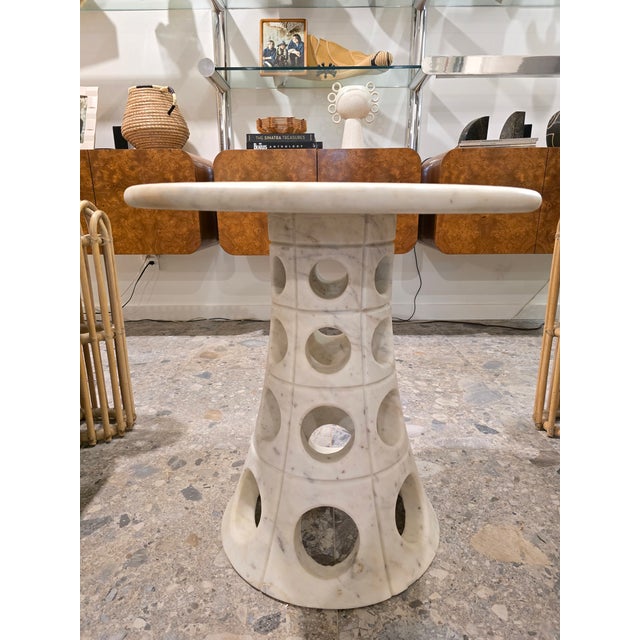 Beautiful marble side table. Made from solid honed white marble. The thick top is removeable as well. Base has sleek...