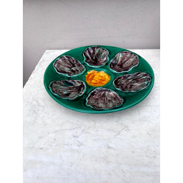 Large French Majolica oyster plate signed TN Bavent, circa 1920. Vibrant emerauld green colors. Diameter / 10.5 inches....