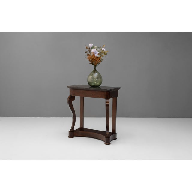 Small sized Empire style French mahogany console table on cabriole legs with original marble top. Circa 1870.