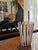 The vase, made of fused rods of milk glass and anthracite-colored glass, is signed Venini (Venini Italy, engraved) and...