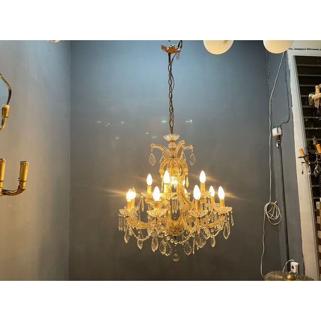 Elegant italian vintage crystal chandelier dating from the 1950s, inspired by the classic maria theresa chandelier style....