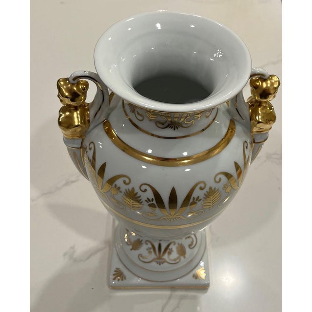 Gorgeous vintage campana porcelain urn with beautiful gold detail. It has female figural handles in gold. This would make...
