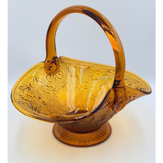 Timeless elegance of this stunning vintage Indiana Glass Tiara Amber Sandwich Basket! This exquisite piece, signed by...