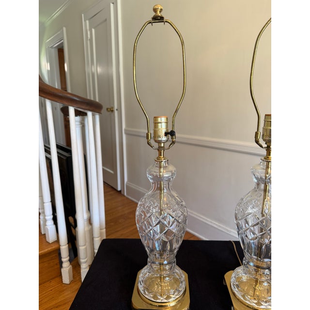 Beautiful tall vintage crystal table lamps in the Waterford Crystal style. The urn shaped lamps feature a classic diamond...