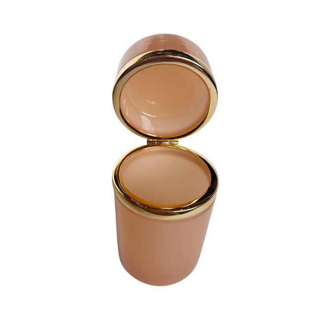French opaline glass canister in a soft blush tone, dating to the 1940s. The form is clean and minimal, elevated by two...