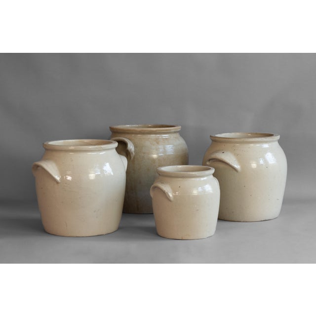 Set of four French stoneware pots. Good overall condition. Circa 1900.