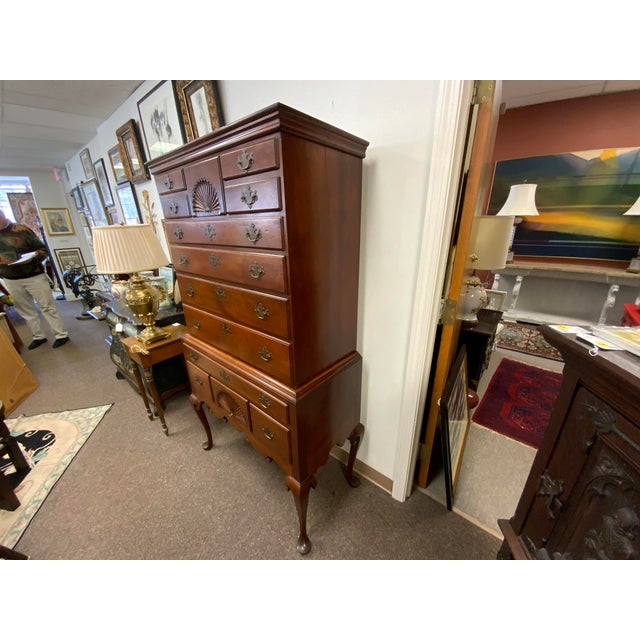 Antique 18th Century Queen Anne Highboy. Cherry wood, fan carving, pad feet, cabriole legs and bat wing pulls. 13 drawers....