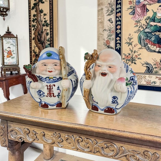 A stunning, highly collectible vintage pair of Chinese Blue and White Porcelain Deities representing Shou Lao (the Star...