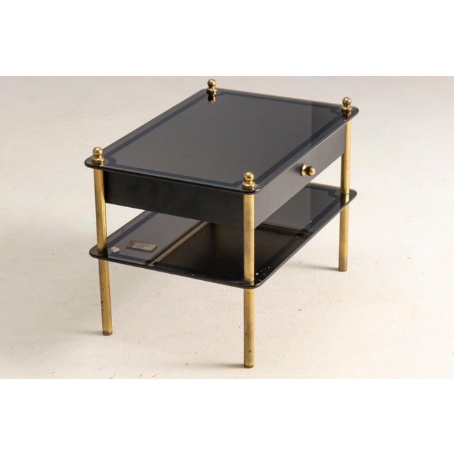 Side table with drawer produced in Europe during the 1970s, reflecting mid-century modern design with clean lines and...