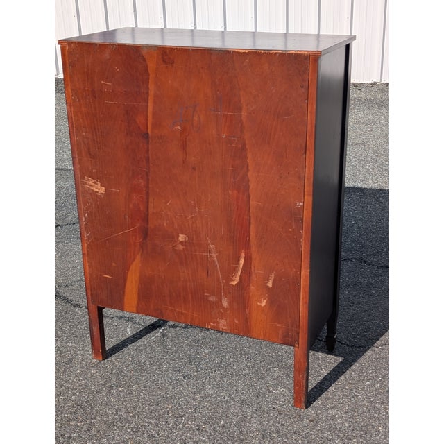 Infuse your home with early American elegance with this vintage 20th-century Federal Hepplewhite-style mahogany chest of...