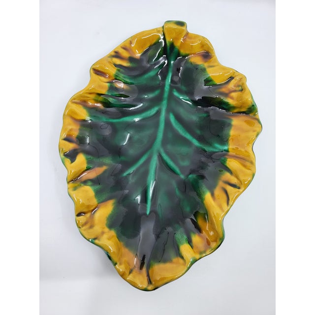 This elegant Vallauris ceramic bowl or trinket dish, emblematic of the 1970s French Riviera, is much more than just an...