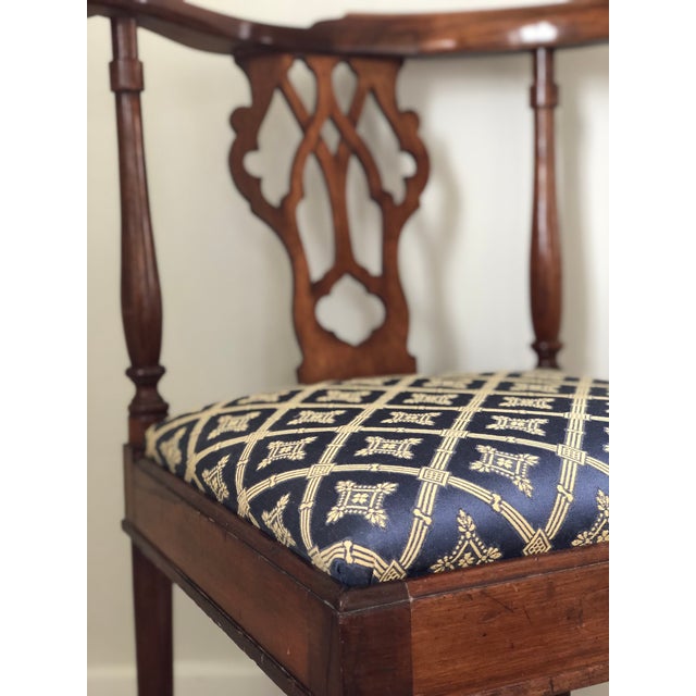 This antique Victorian corner chair dates to the late 19th century and is crafted from solid mahogany. The chair stands on...