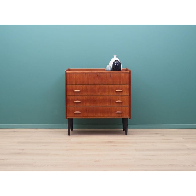 The dressing table was made in the 1960s, Finnish production. The structure is covered with teak veneer. The legs and...