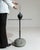 Round stone-base side table in Deep Charcoal Grey. Its deep charcoal grey finish sets off rounded natural stone base, slim...
