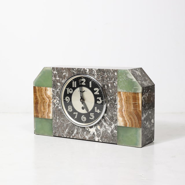 This striking Art Deco mantlepiece clock is a refined representation of French design from the 1930s. The clock is crafted...