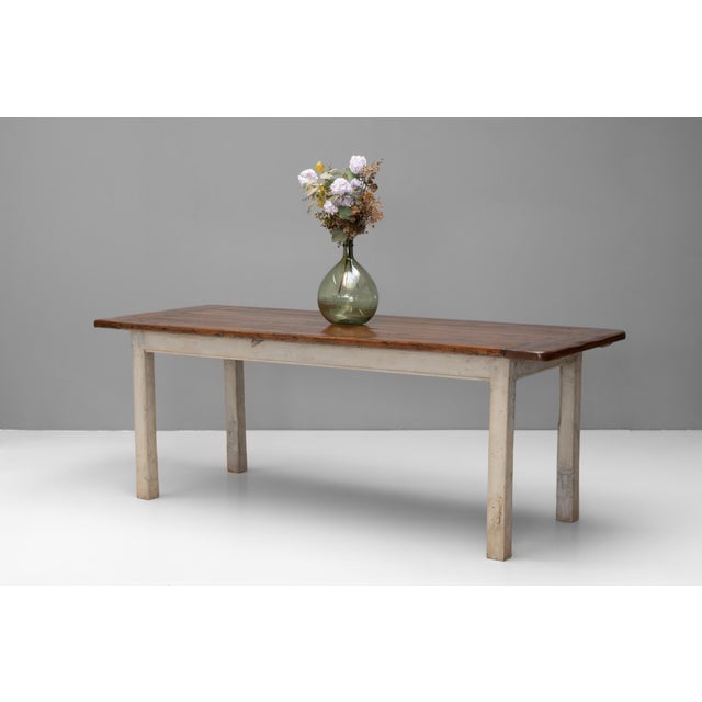 Plank top farm table in pine with later painted base. Circa 1900.